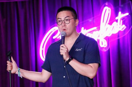 bowen yang performing his stand up comedy on stage 